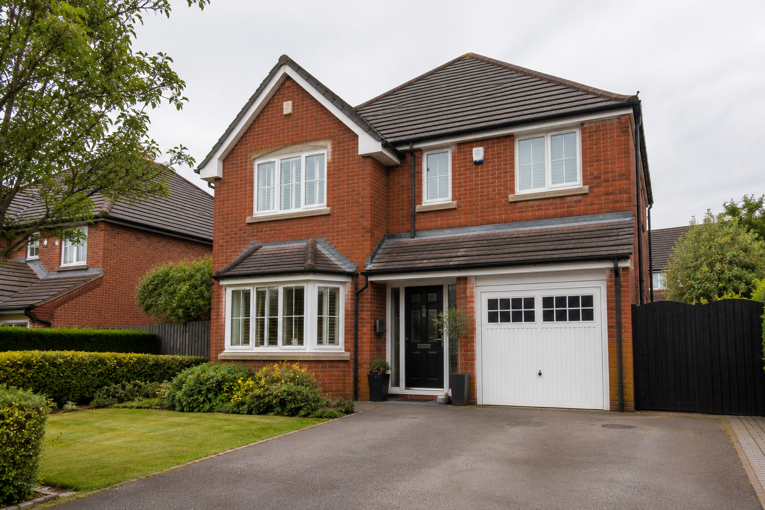 Home with a drive and front garden
